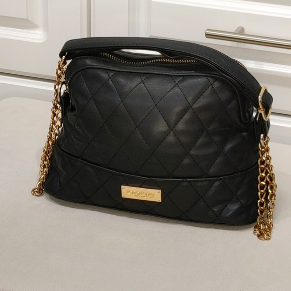 bebe Handbags - bebe black purse the straps which are made of metal are a little discolored